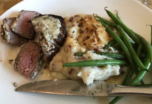 a plate of food with a knife and fork