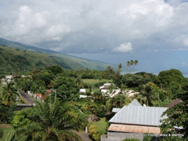 a view of a village and mountains