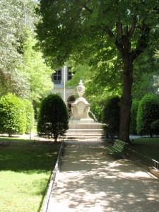 a white statue in a park