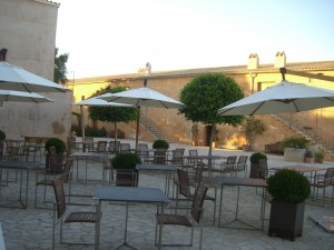 a group of tables and chairs outside