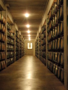 a long hallway with rows of barrels