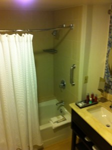 a bathroom with a shower and sink