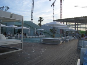 a pool with umbrellas and chairs