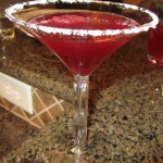 a red drink in a martini glass