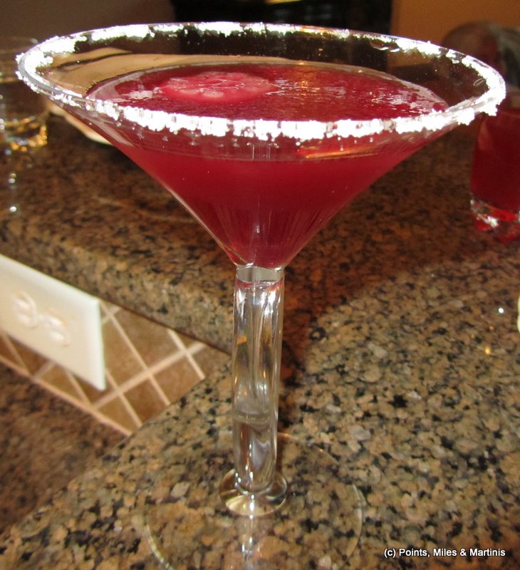 a red drink in a martini glass