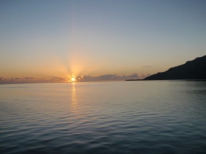 a sunset over a body of water