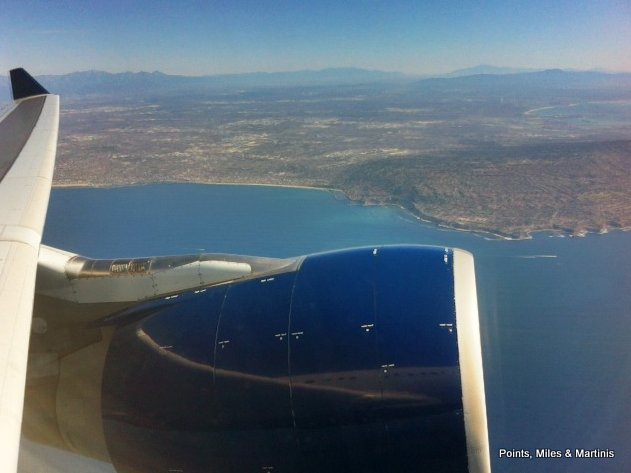 an airplane wing and body of water