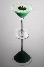 a green drink in a martini glass