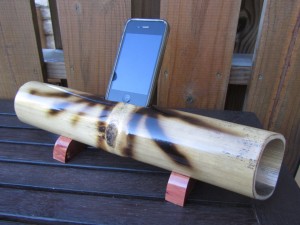 a cell phone in a bamboo tube