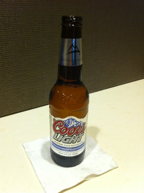 a bottle of beer on a napkin
