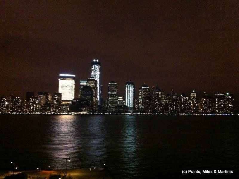 a city skyline at night with lights on