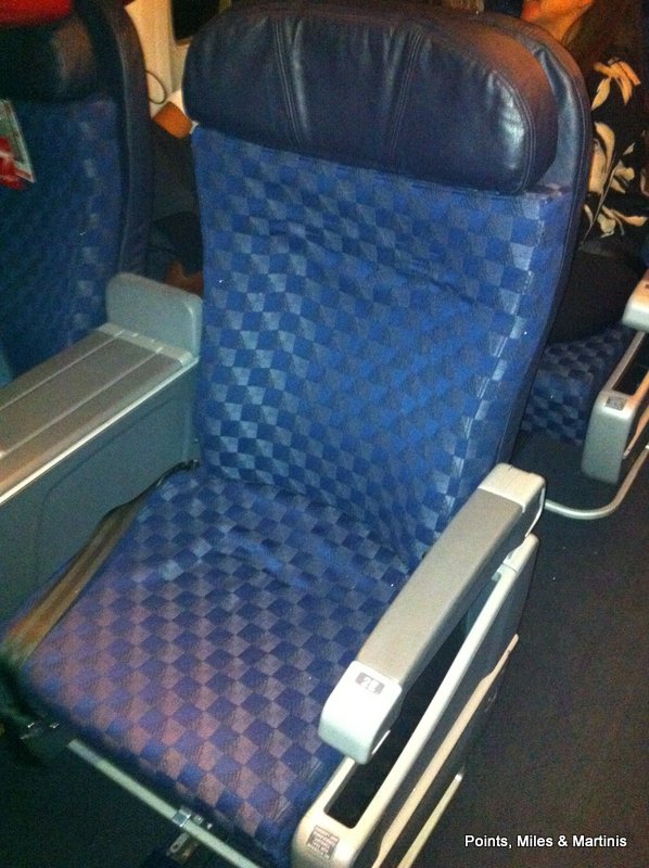 a blue and grey airplane seat