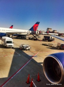 a group of airplanes at an airport