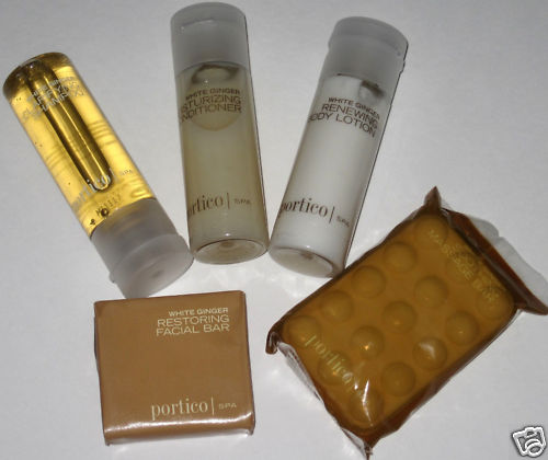 a group of small bottles of body lotion and a package of blisters