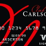 a credit card with red and white text