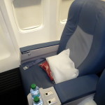 a seat with a pillow and a pillow on it