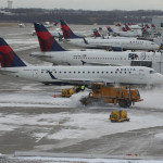 a group of airplanes parked in a row