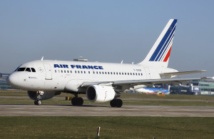 a white airplane on a runway