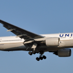 a white airplane flying in the sky