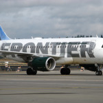 a white airplane on a runway