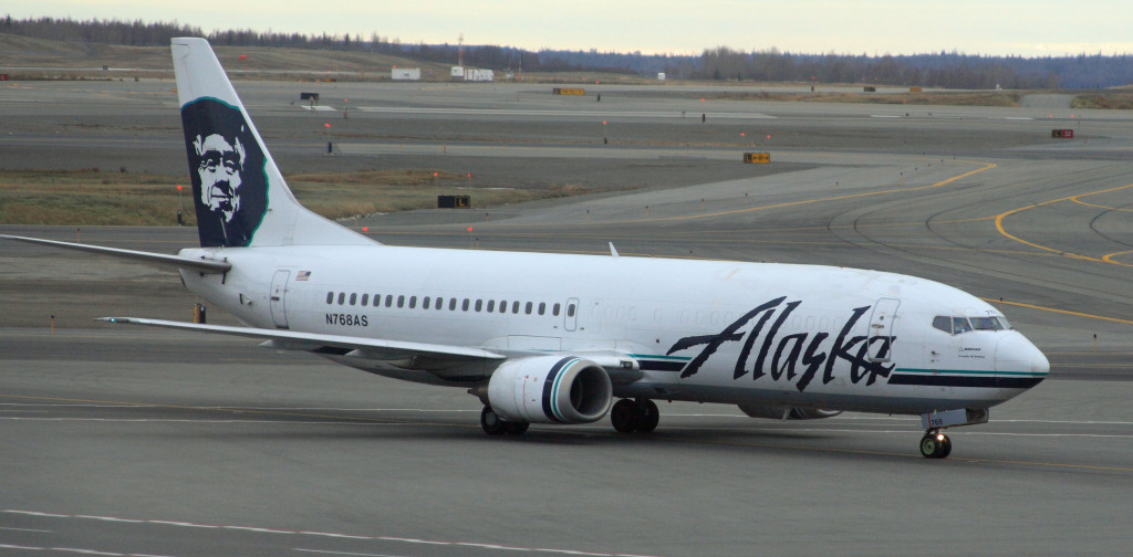 a white airplane on a runway