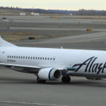 a white airplane on a runway