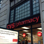 a sign on the front of a pharmacy