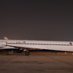 a white airplane on a runway