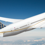 a white airplane in the sky