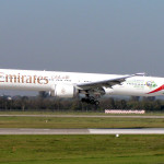 a large white airplane taking off