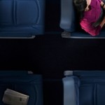 a woman sleeping on a seat