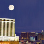 full moon over a city