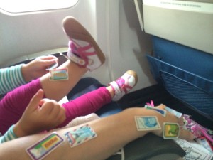 a child's legs with stickers on them