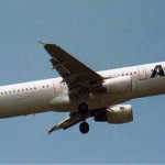 a white airplane in the sky