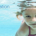 a young girl swimming underwater