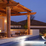 a pool with a fire pit and a fire pit