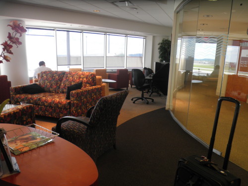 The only differences between the Altitude Lounge and a doctor's office is that the Altitude has luggage in it, and fewer people!