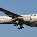 a white airplane in the sky