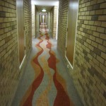 a hallway with a red and orange carpet