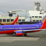 a group of airplanes at an airport