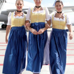 a group of women wearing blue and yellow dresses