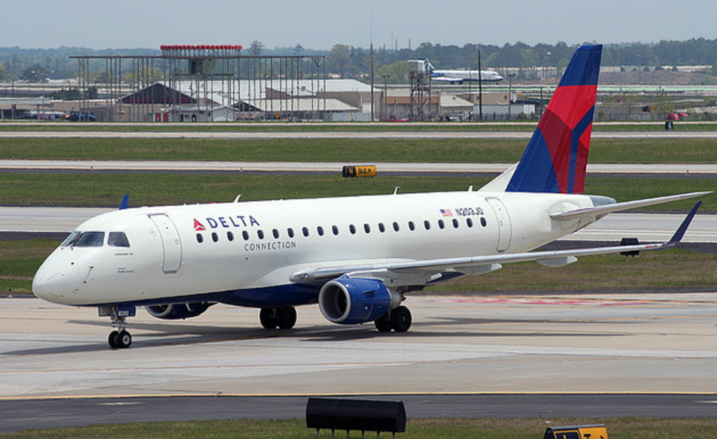 a white airplane on a runway