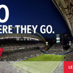 a stadium with a football field and a football field