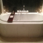 a bathtub with candles on it