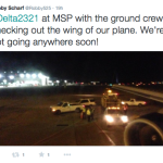 a group of people on a runway at night