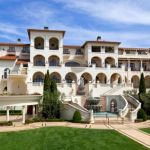 a large white building with a fountain