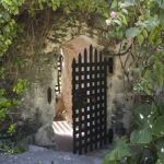 a gate in a stone wall