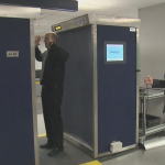 a man standing in a metal detector