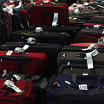 several suitcases with tags on them