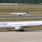 a group of airplanes on a runway